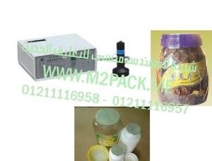 مكن لحام طبات الالمونيوم فويل علي فوهة برطمنات الشيكولاته الاكلير